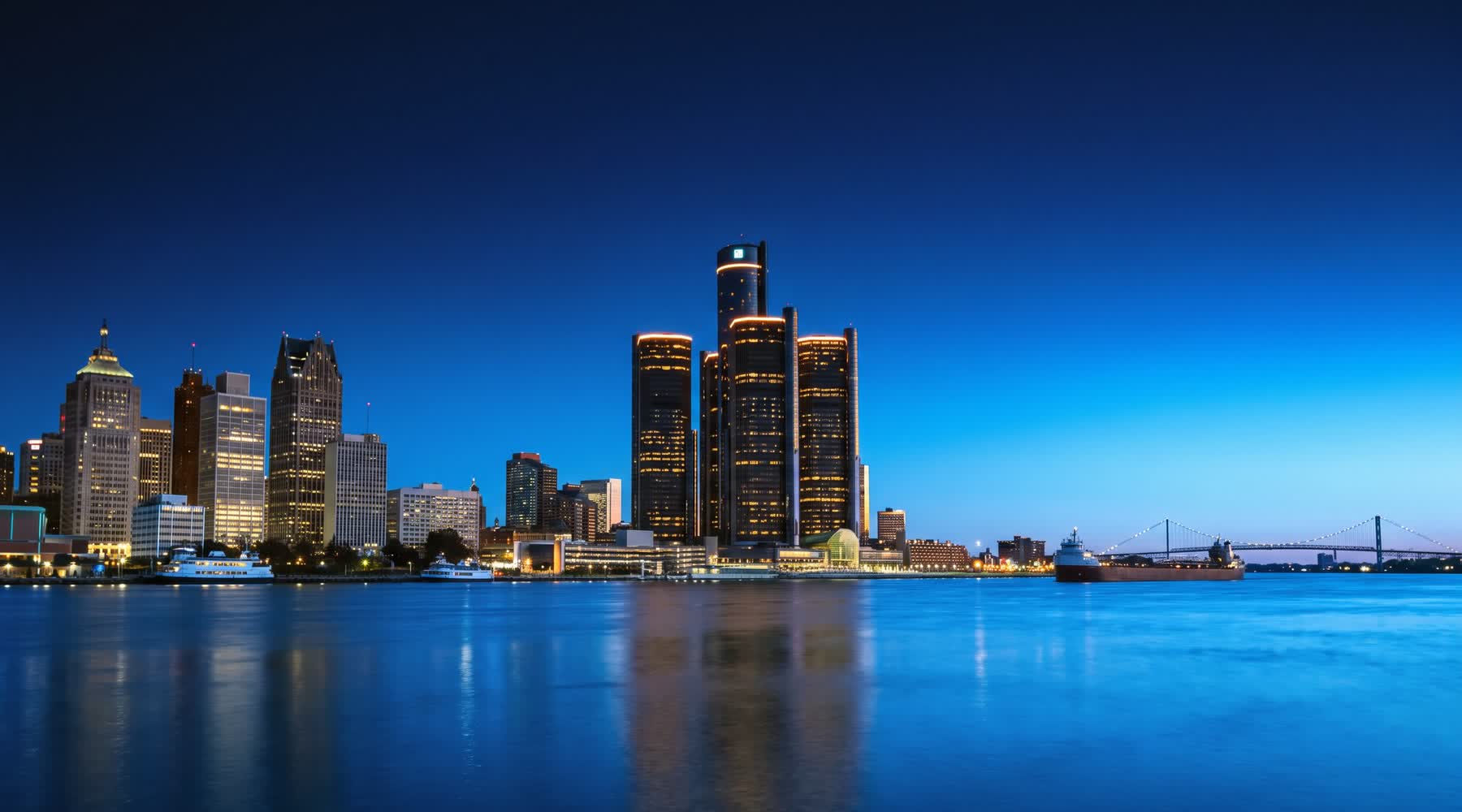The Detroit skyline at blue hour seen across the river.