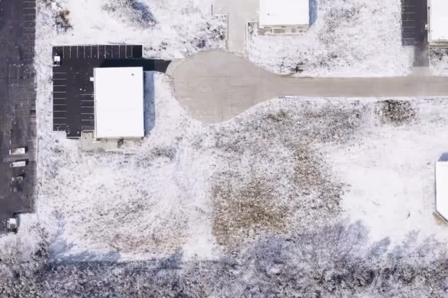 Overhead aerial photograph of the vacant Livonia industrial land parcel with road frontage.